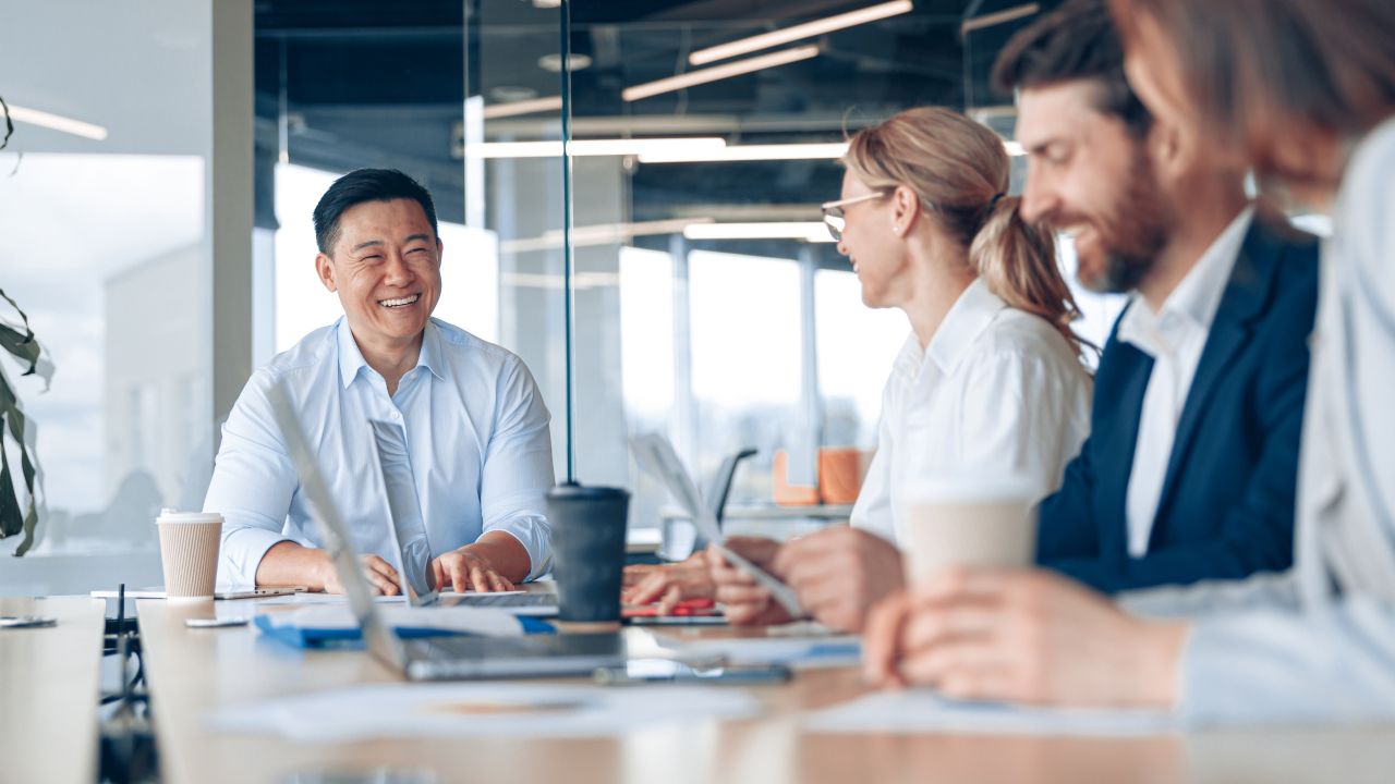 Group On Business Professionals Around A Table