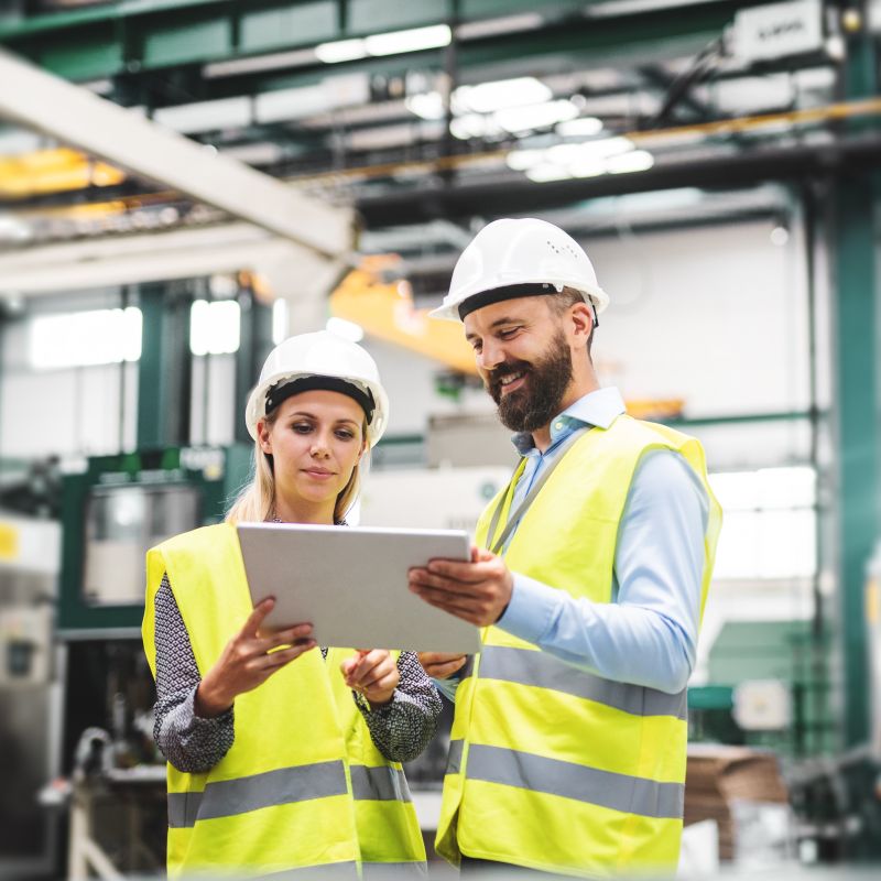 Man And Woman In Ppe Talking